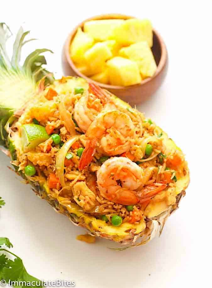 Enjoying pineapple fried rice on the pineapple half shell