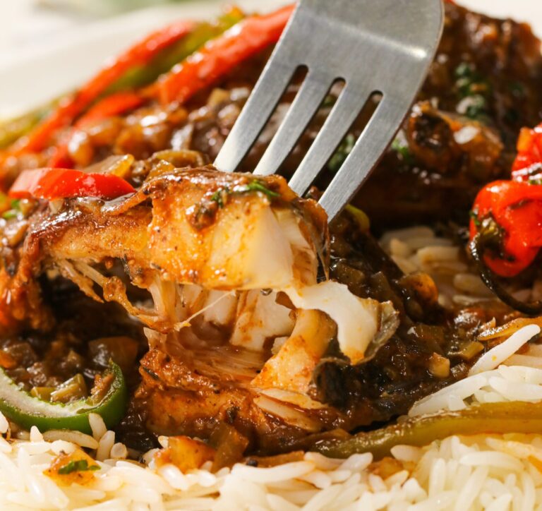 Enjoying flaky, spicy brown stewed fish