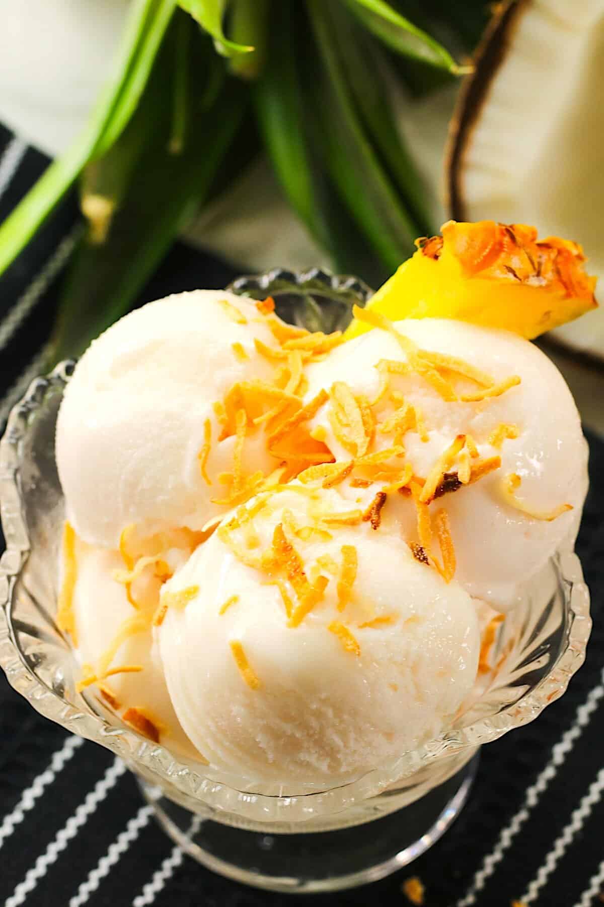 A refreshing bowl of pineapple coconut ice cream ready for the hottest summer day