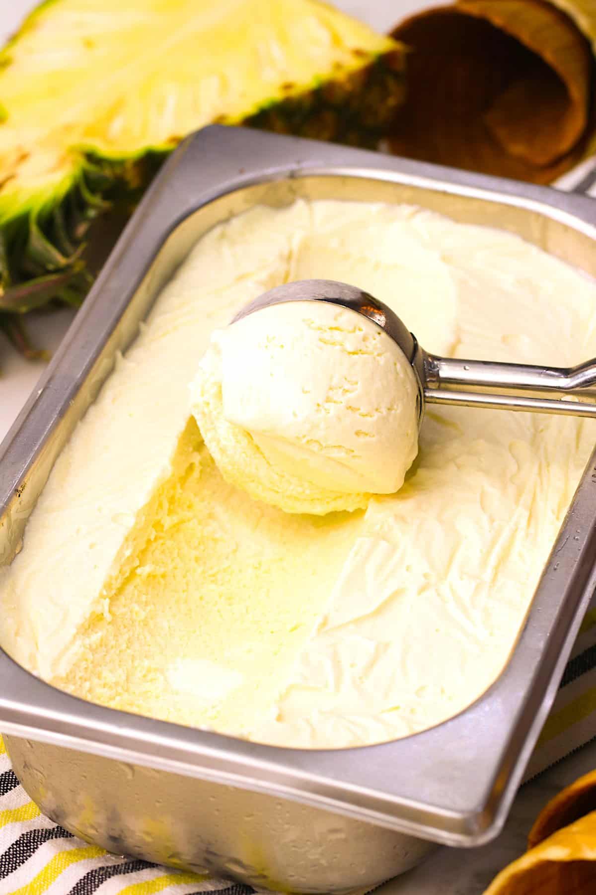 Scooping a serving of homemade no-churn ice cream