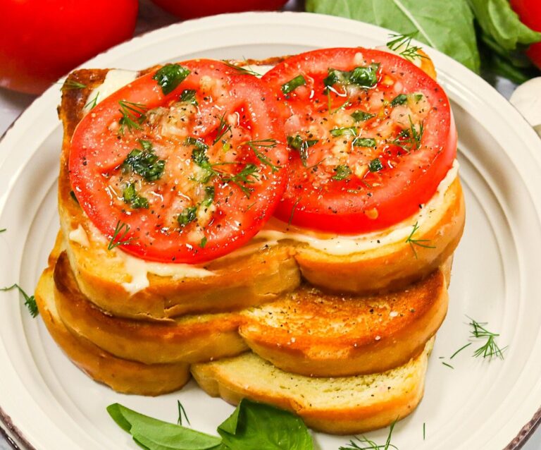 Enjoying a Southern tomato sandwich, one as a classic and the other open-face