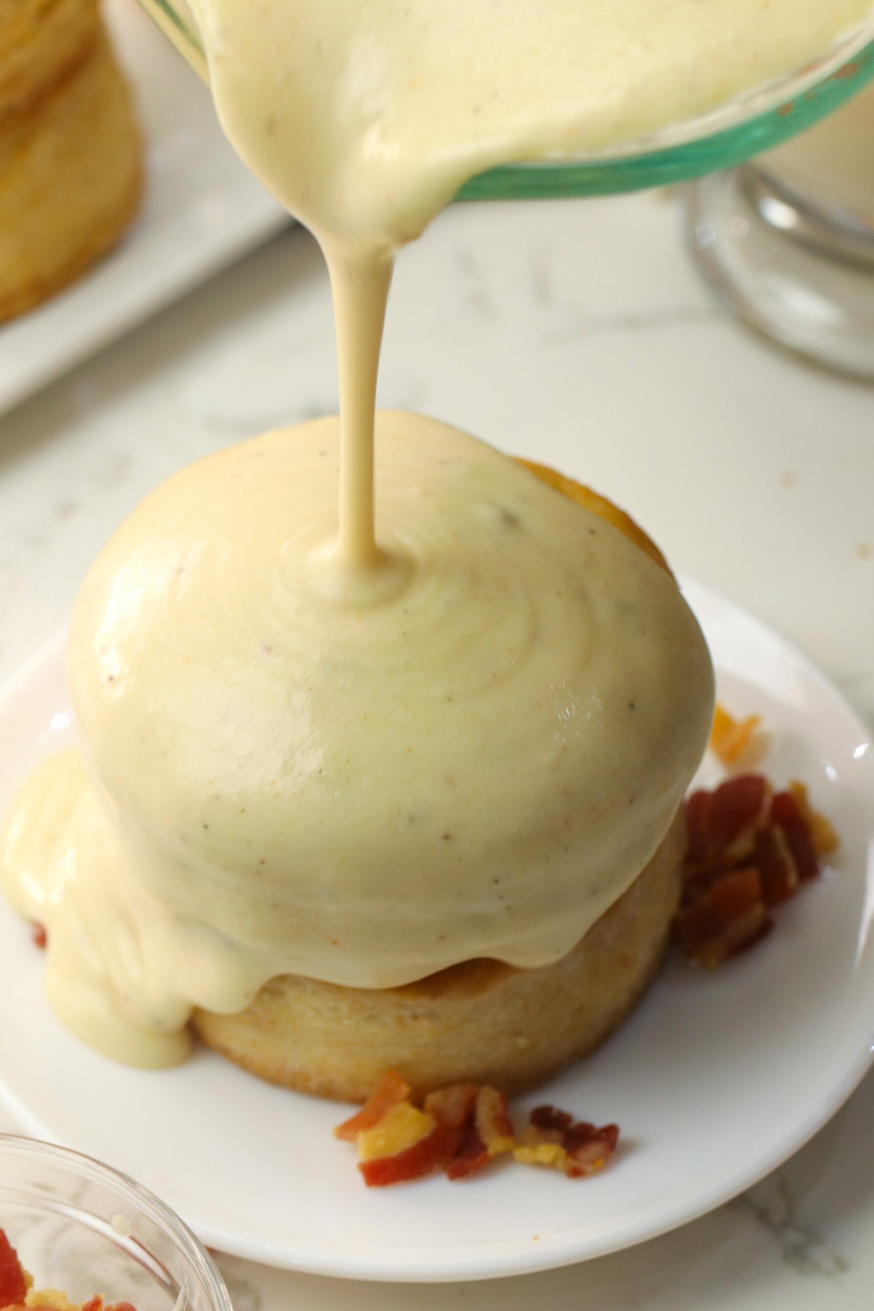 Amazing homemade biscuits poured with fresh bacon gravy