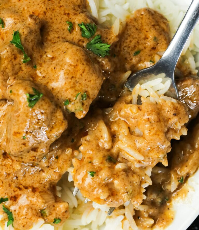 Enjoying homemade groundnut soup with white rice for an easy weeknight meal