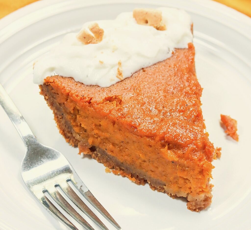 Diving into an insanely good slice of sweet potato pie in a graham cracker crust