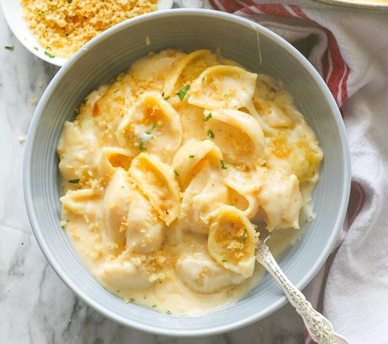 Diving into a bowl of delicious white cheddar mac and cheese