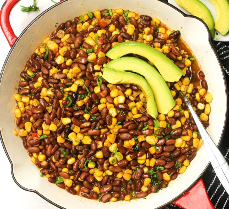 Getting ready to serve freshly made githeri with avocado slices