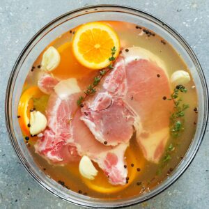 Pork chops brining for an extra tender and juicy dinner