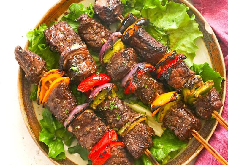 Soul-satisfying steak kabobs on a bed of lettuce
