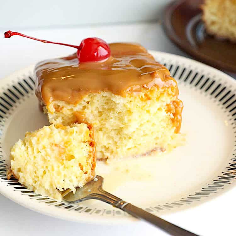 Forking into a decadent slice of cuatro leches cake