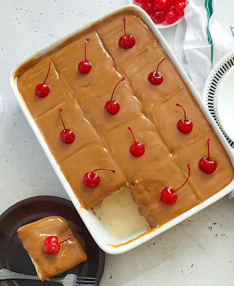 Diving into a decadent cuatro leches cake with cherries on top