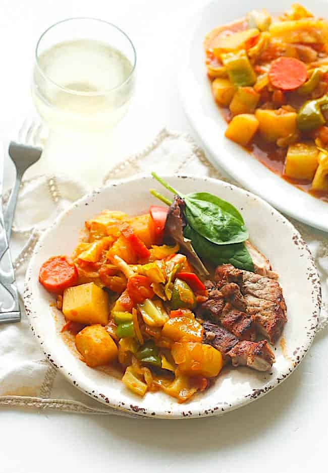 Enjoying a healthy serving of Ethiopian cabbage and potatoes with beef and spinach