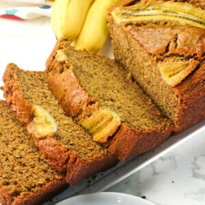 Slicing into fresh brown butter banana bread for an elevated snack