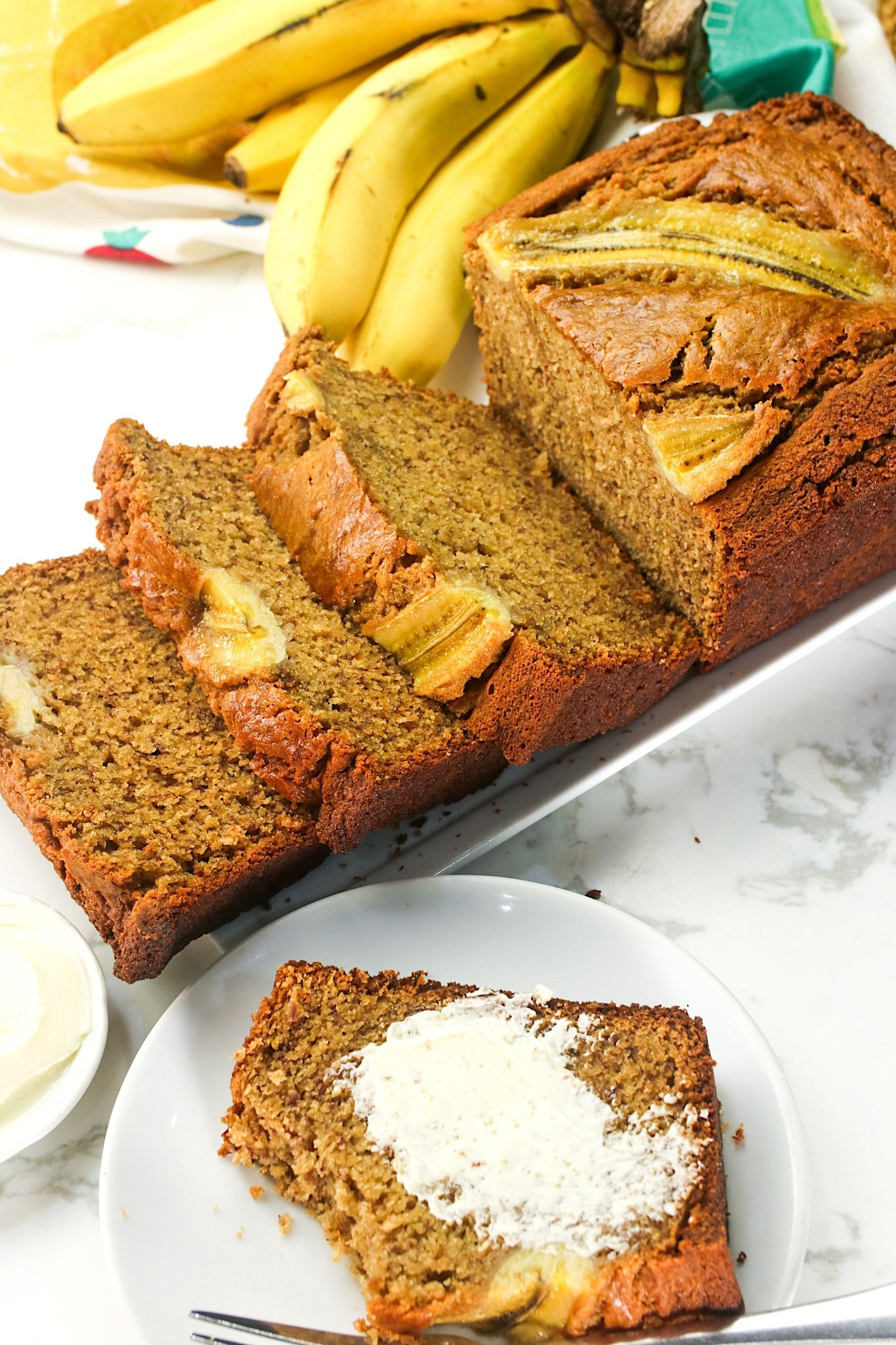 Slicing into fresh brown butter banana bread for an elevated snack
