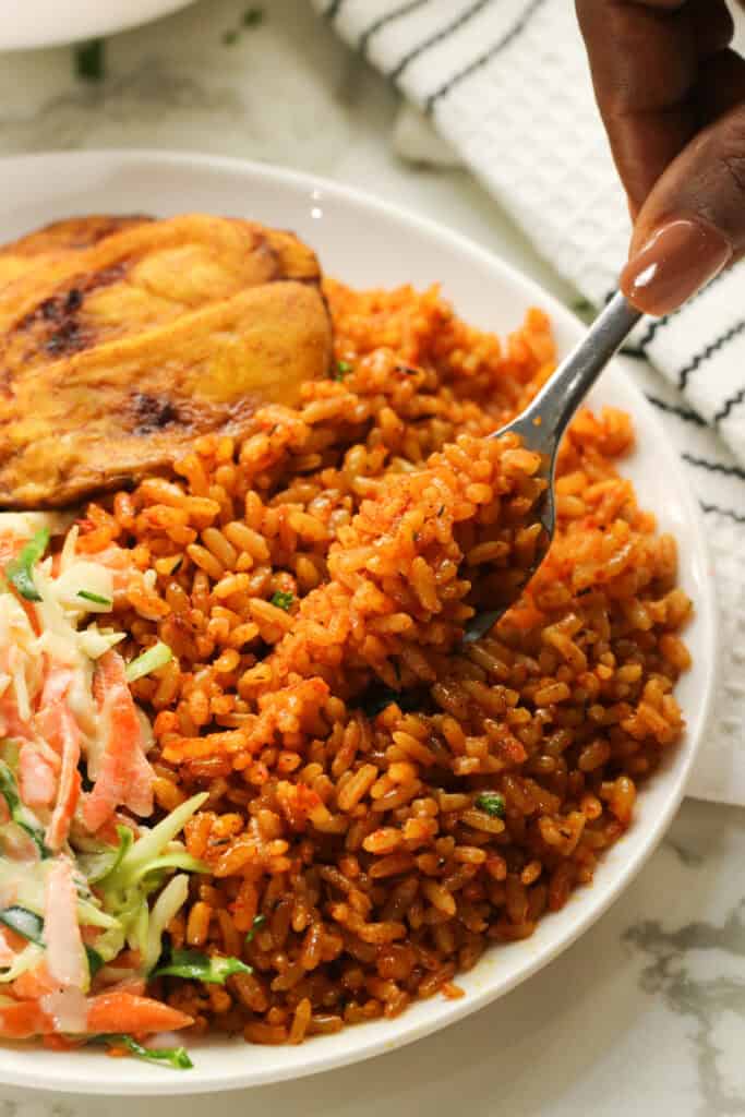Enjoying a forkful of savory Nigerian jollof rice on a crazy weeknight