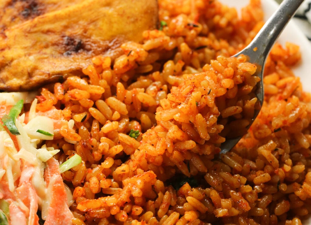 Enjoying a forkful of savory Nigerian jollof rice on a crazy weeknight