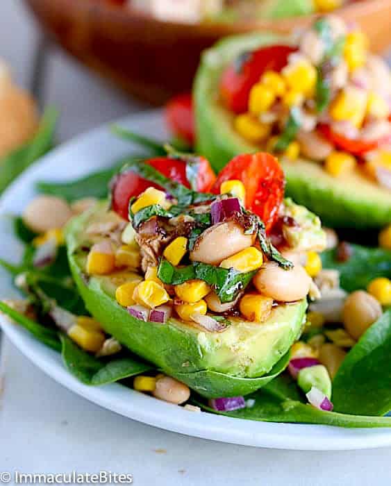 Stack white bean and tuna salad in half avocado for a cool main dish salad