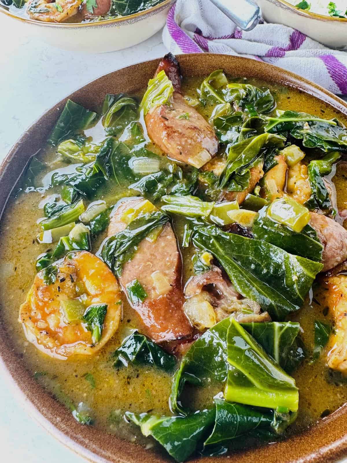 Amazing green gumbo with collard greens, shrimp, and smoked sausage
