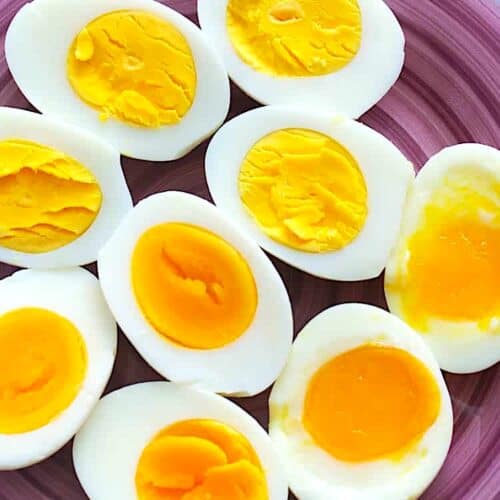 Jammy and hard boiled eggs on a plate ready to enjoy