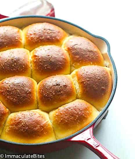 Pani popo fresh from the oven in a warm coconut sauce