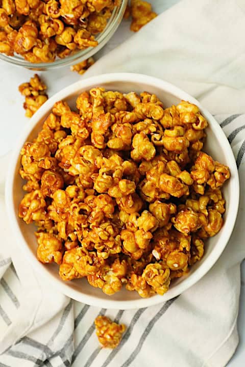 Enjoying homemade caramel popcorn for the perfect movie-night treat.