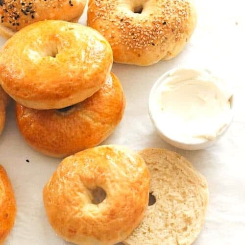 Slicing into a bagel ready to spread cream cheese for a satisfying breakfast