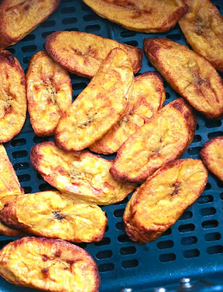 Sliced plantains ready to come out of the air fryer.