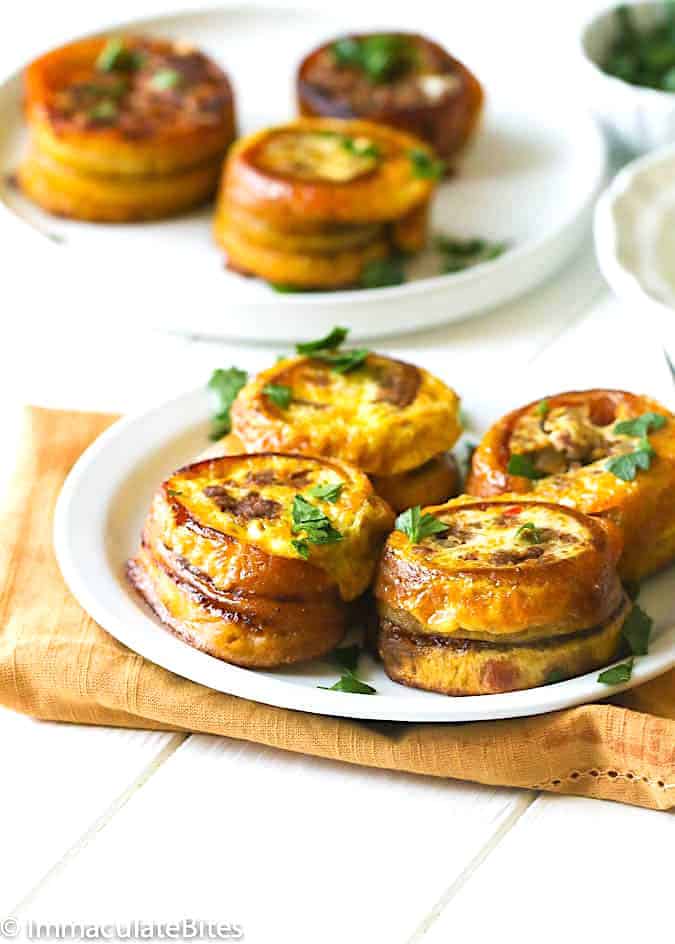 Enjoying sweet and savory stuffed plantains or Puerto Rican pionono.