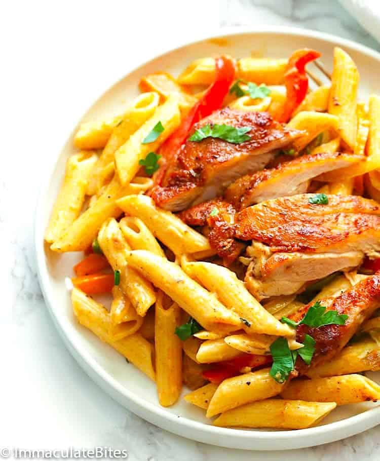 Serving up penne pasta with a creamy sauce and delicious vegetables.