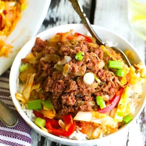 Comfort food in a bowl with canned corned beef, cabbage, and healthy vegetables.