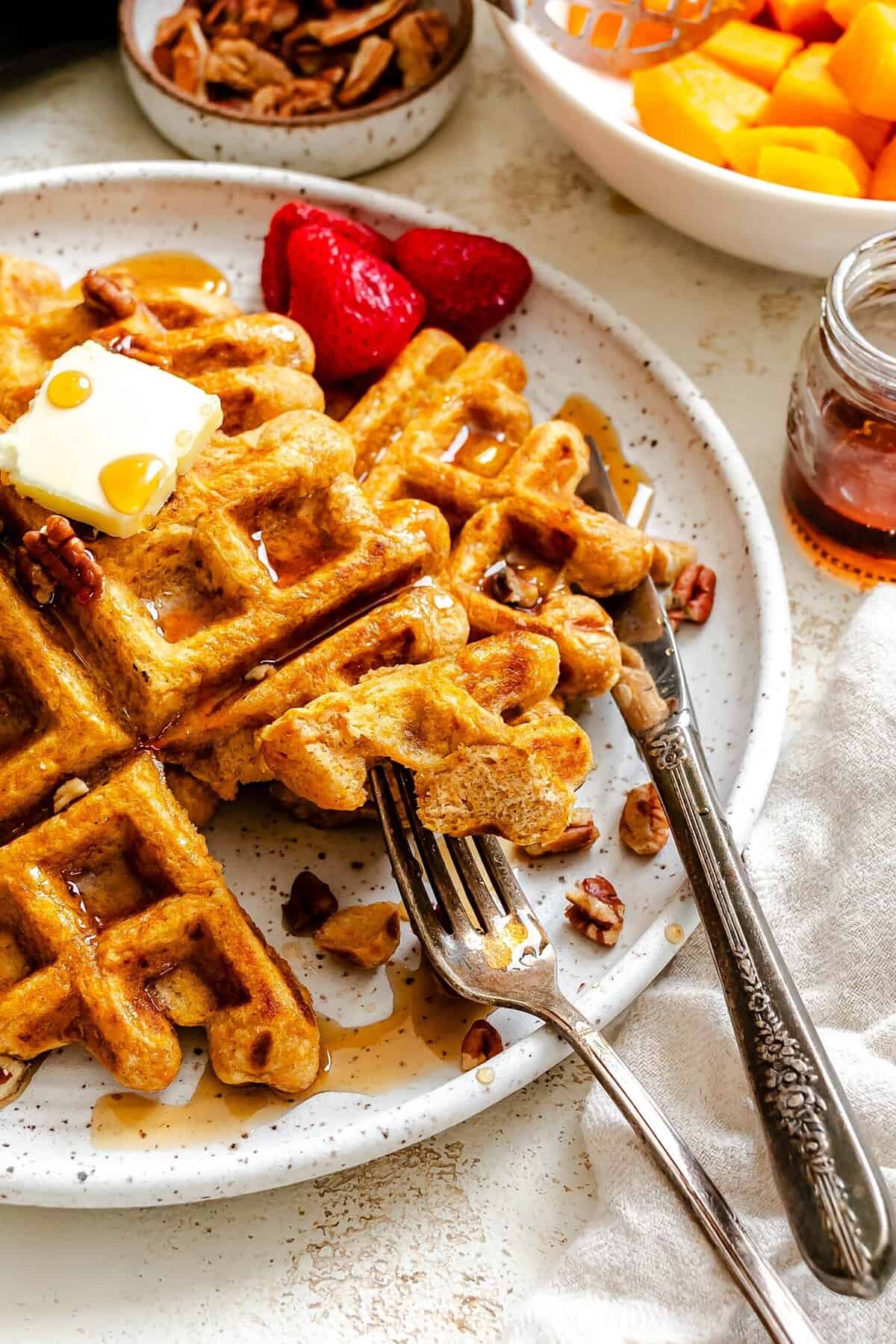 Forking into a tender, tasty waffle ramped up with sweet potatoes.