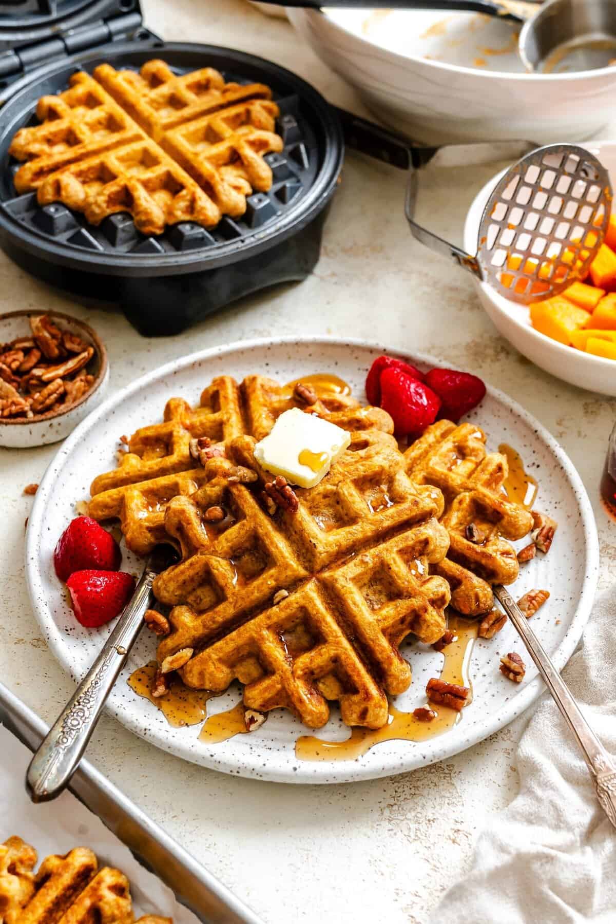 Devouring fresh waffles while more are cooking.