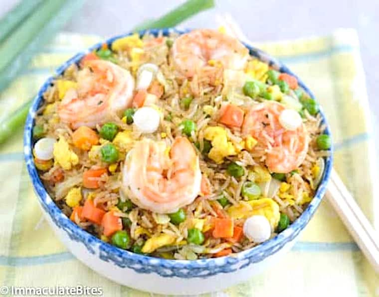 Enjoying fried rice and shrimp with an African-Caribbean twist.