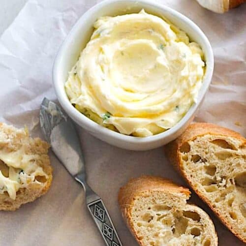 Serving herbed butter the easy way, in a bowl with a butter knife.