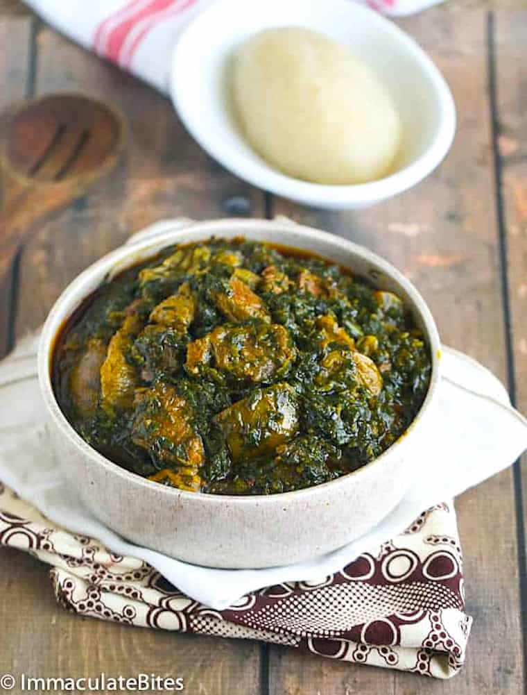 Enjoying a bowl of eru soup, a healthy green and African comfort food.