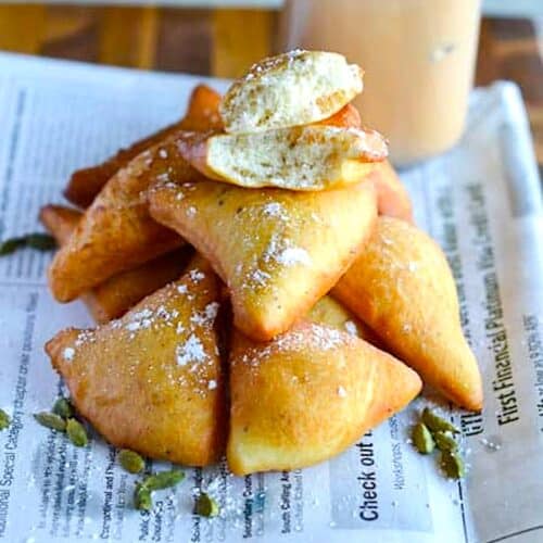 Breaking into a fresh East African doughnut for soul satisfaction.