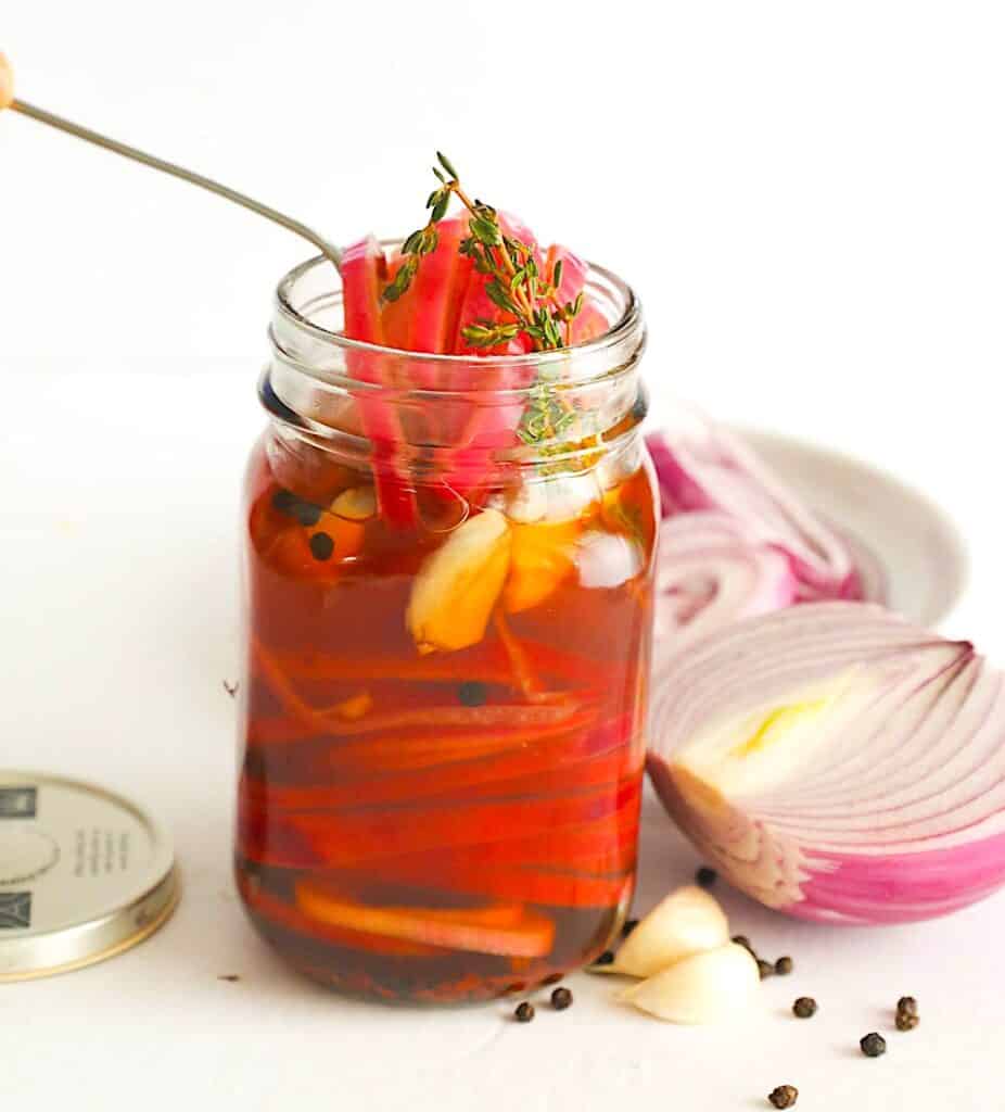 Serving up pickled onions seasoned with thyme.