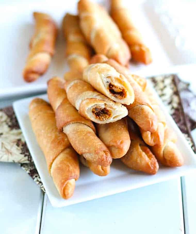 Breaking open a fish pie and getting ready to enjoy it.