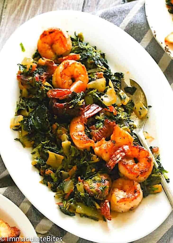 Serving up a tasty dish of stewed spinach African style with shrimp.