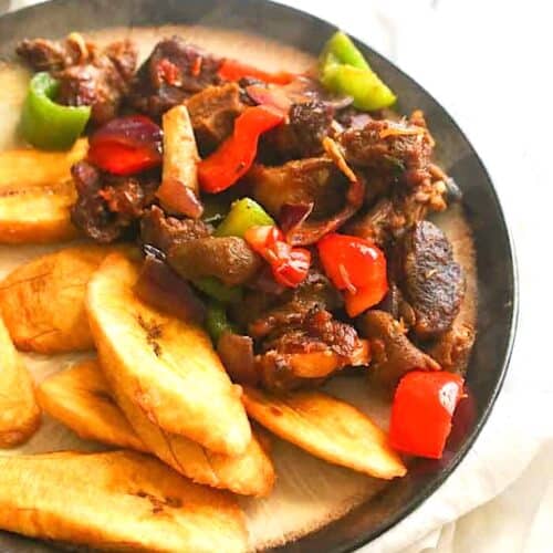 Serving up asun with fried sweet plantains.