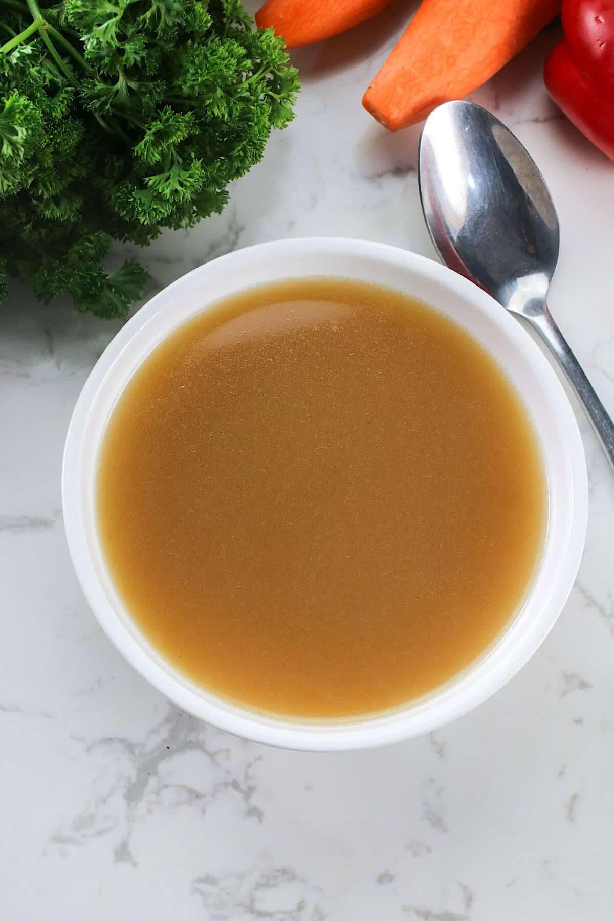 Letting a large bowl of homemade stock cool for storage.