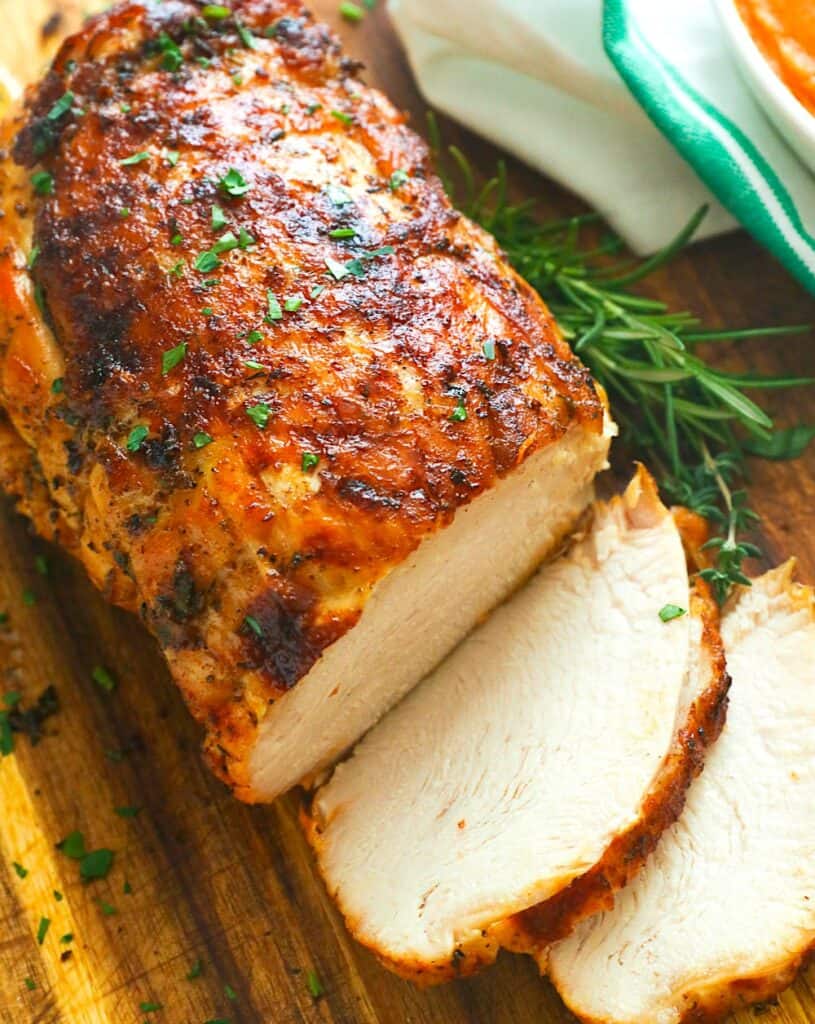 Slicing into a tender, juicy Instant Pot turkey breast for a perfect holiday entree.