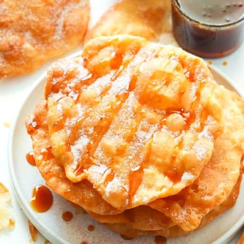 Freshly fried bunuelos drizzled with panela syrup.