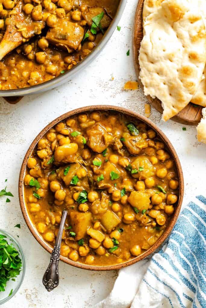 Serving up a comforting bowl of chickpea curry with flatbread for the perfect vegan option.