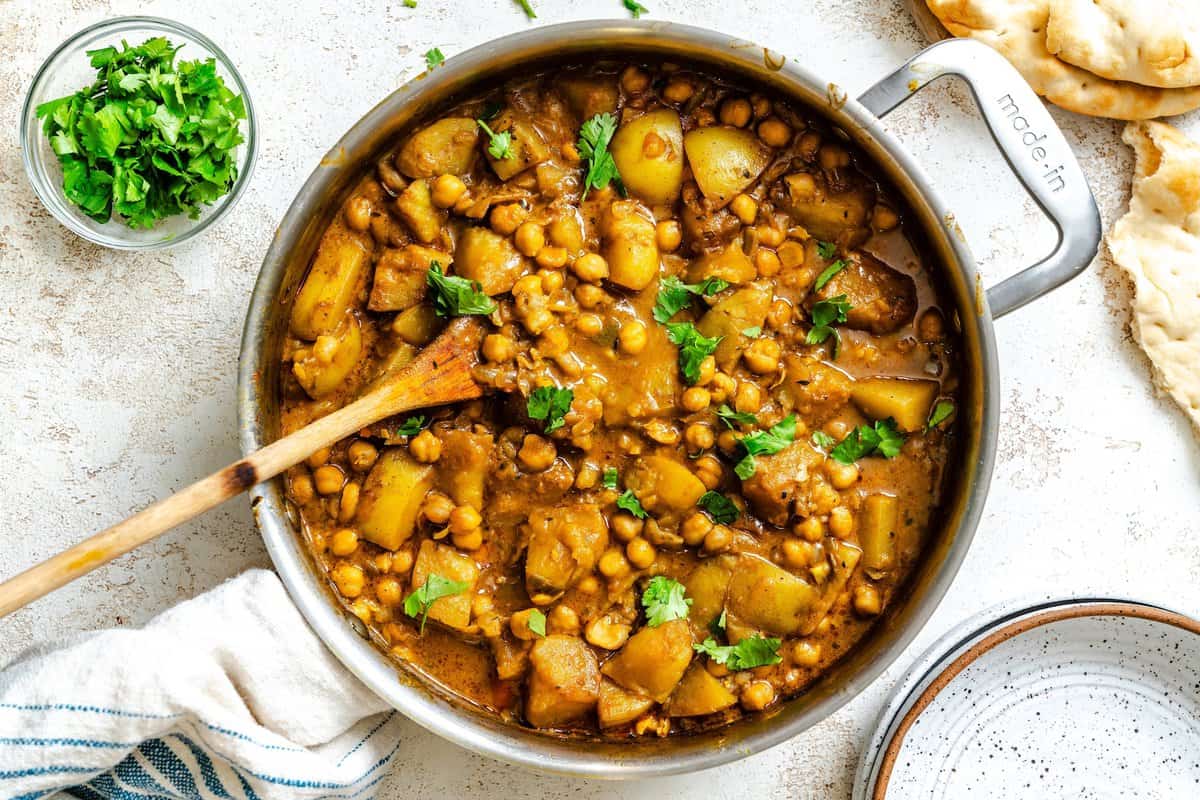 A pot of chickpeas and potatoes simmered in coconut curry for an easy meat-free Monday.