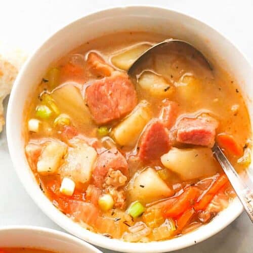 Diving into a bowl of comforting soup loaded with ham and beans.