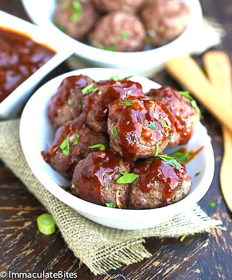 Appetizer meatballs glazed with a pineapple BBQ sauce.