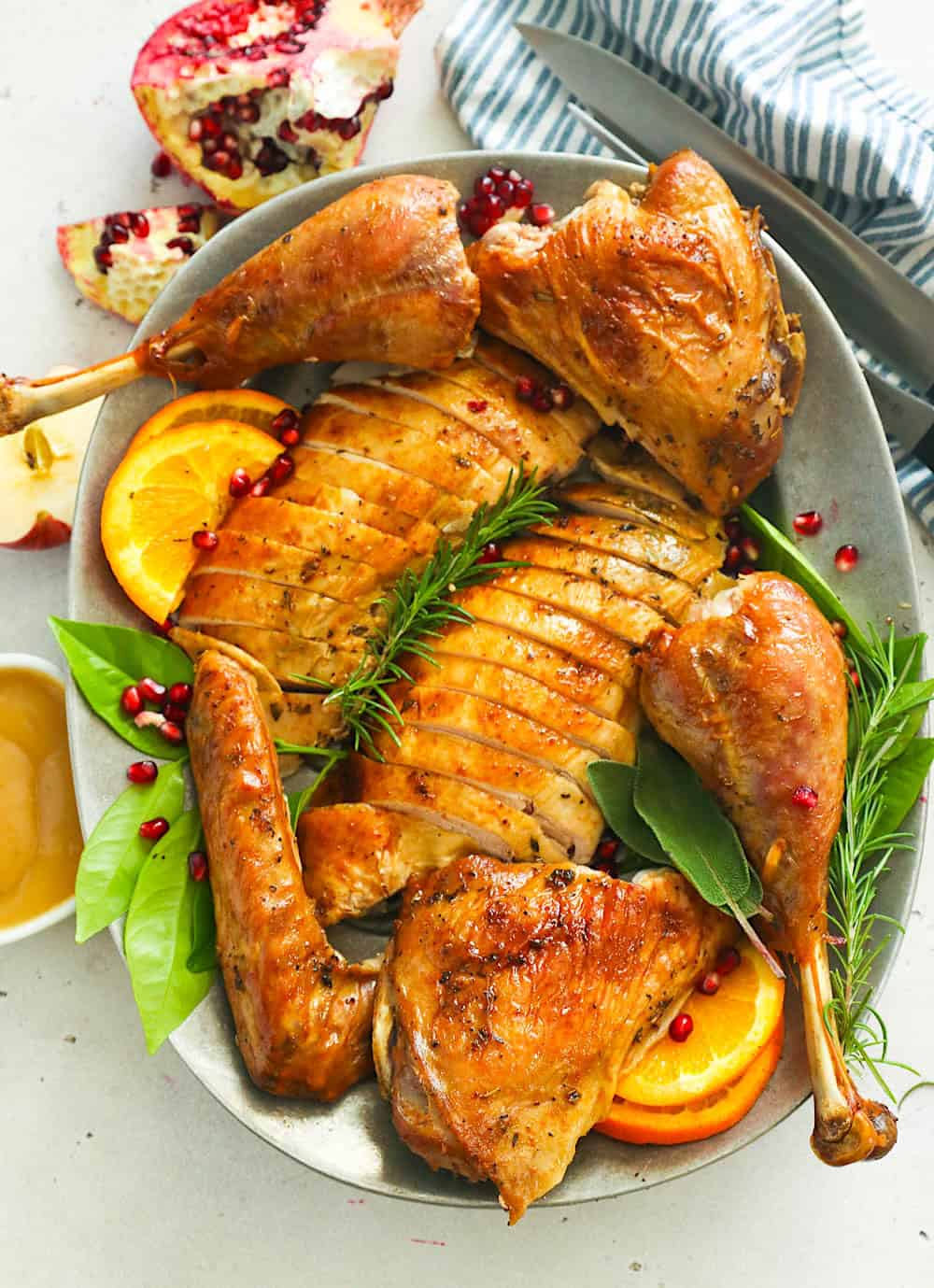 Roasted spatchcocked turkey on a platter ready to serve.