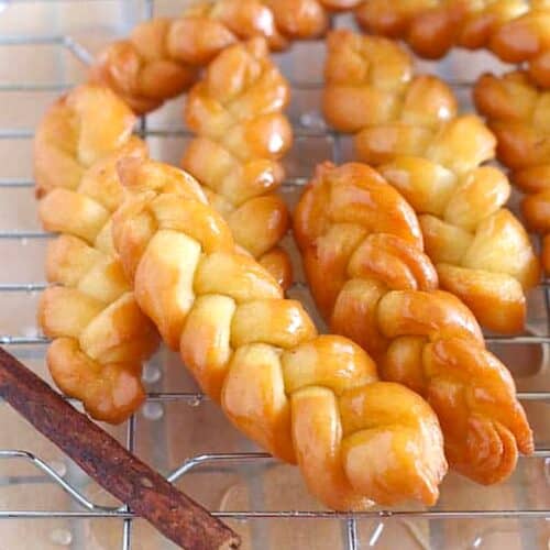 Traditional koeksisters freshly fried and soaked in syrup.