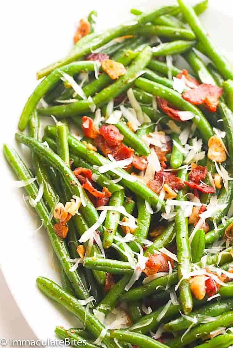 Serving up a platter filled with green beans and bacon.