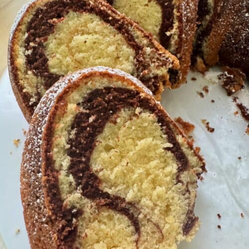 Showing off the chocolate swirls in a vanilla cake.